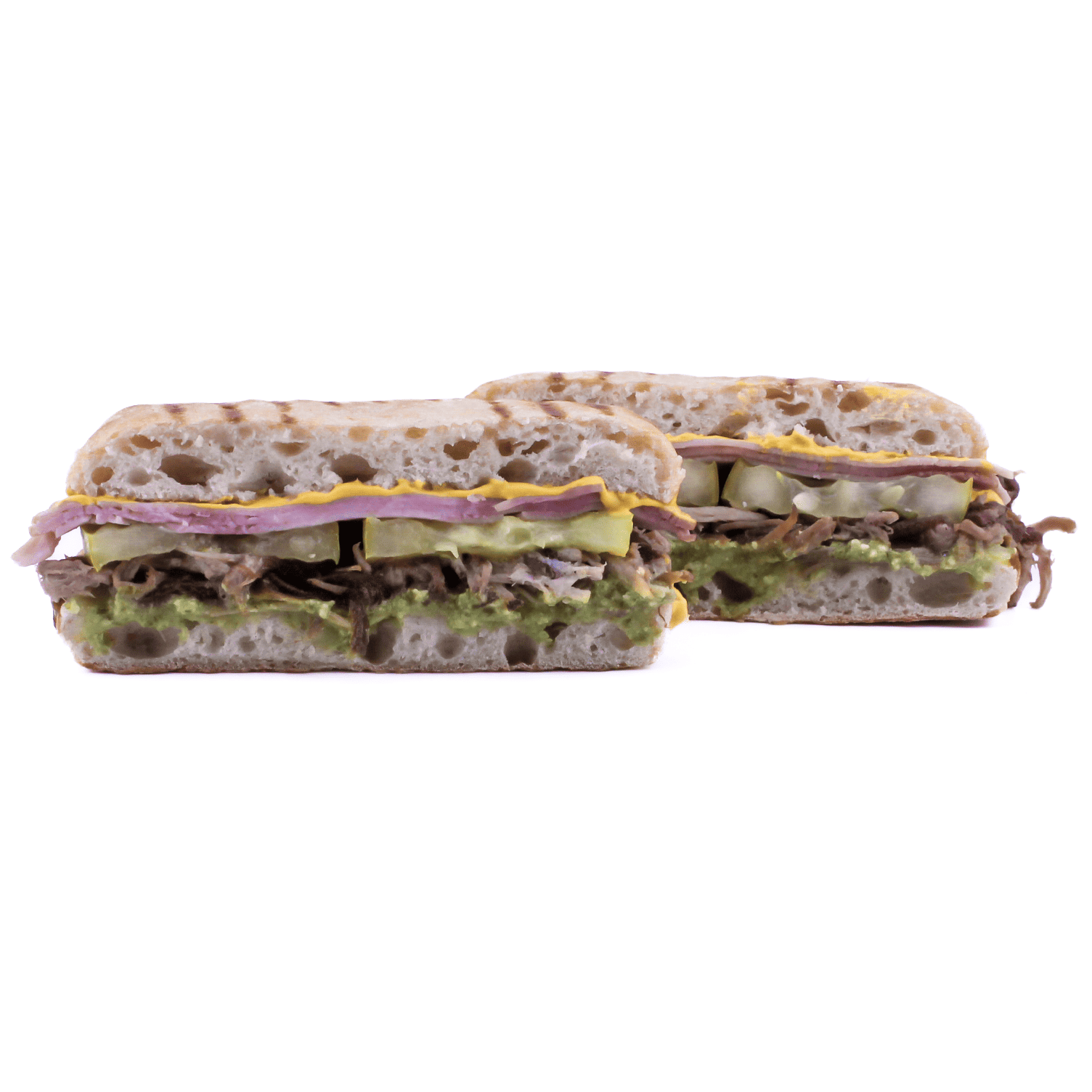 Cubano - Slow roasted pork and onions, ham, yellow mustard, Swiss cheese, pickles, green goodness dressing on pressed ciabatta