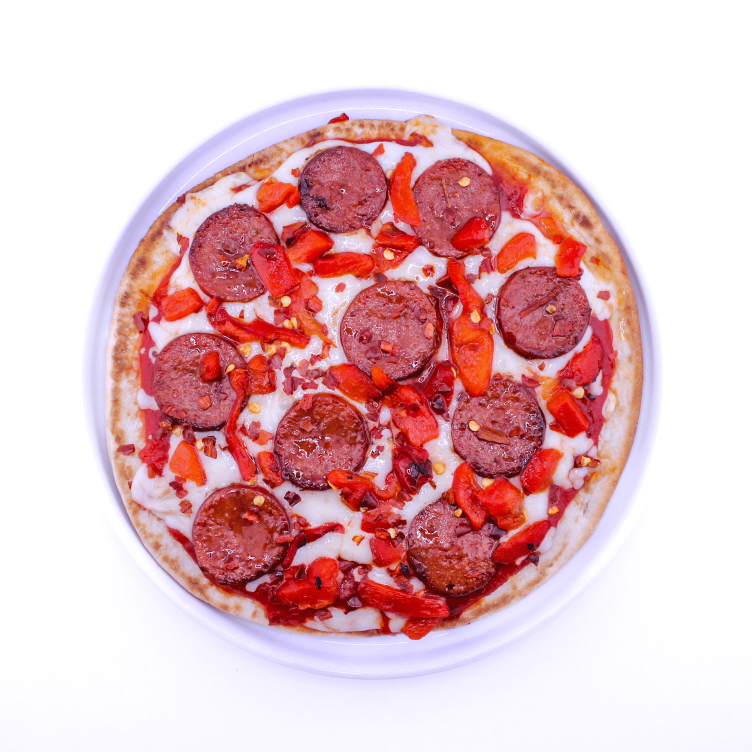 P&P - Pepperoni, roasted red peppers, red pepper flakes, honey, tomato sauce, mozzarella cheese, whole wheat flatbread
